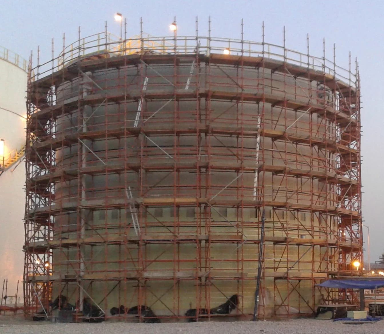 Scaffolding erected around an industrial tank